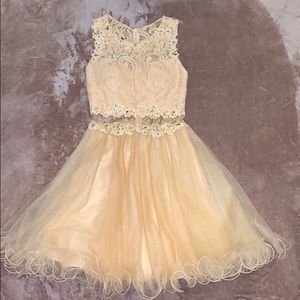 Short peach color dress.